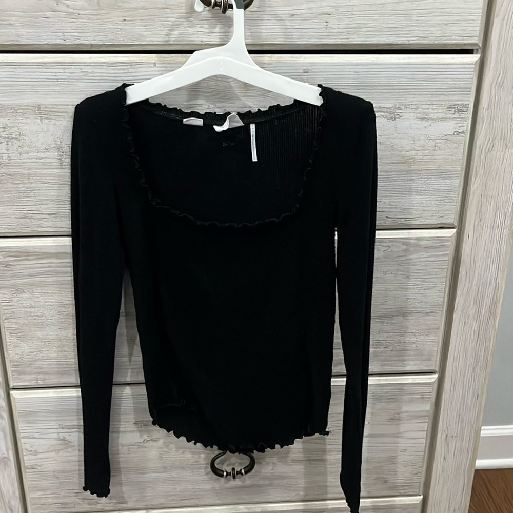 Out From Under black long sleeve top with fringed outline